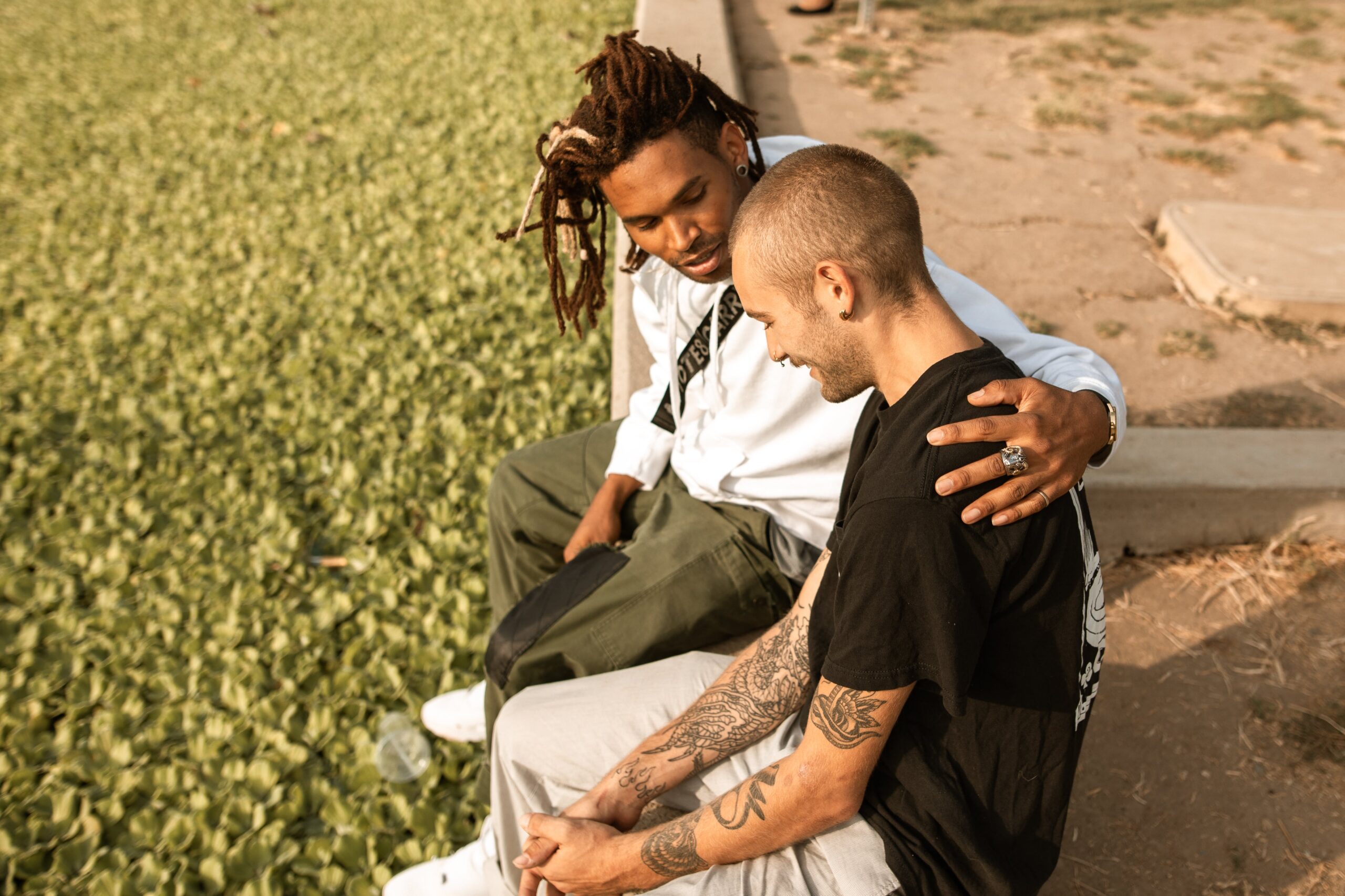 Man comforting his friend